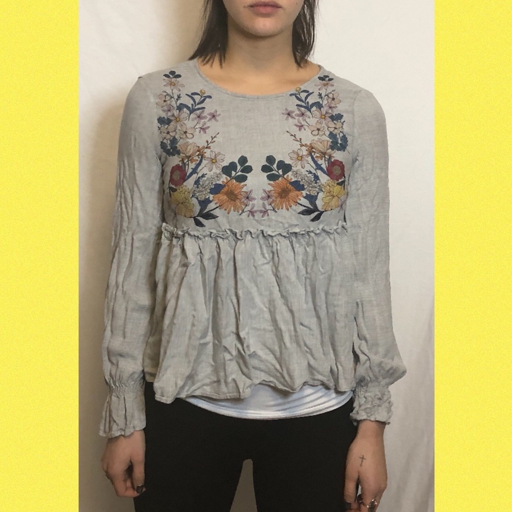 grey t-shirt with floral print on the front